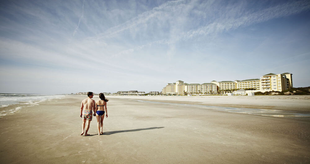 beach walking couple