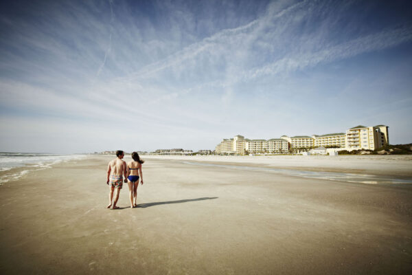 beach walking couple