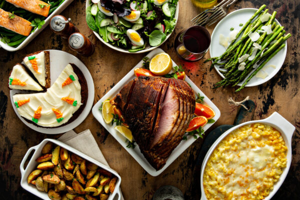 Easter dinner table with ham, asparagus and cake