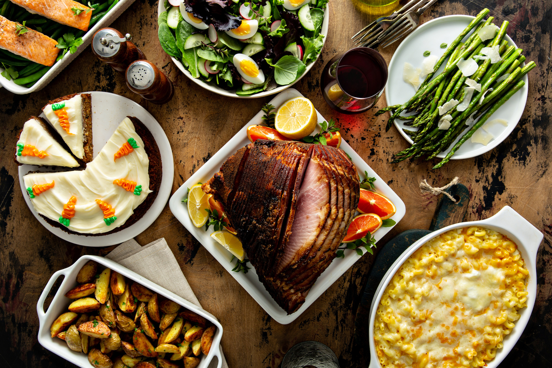 Easter dinner table with ham, asparagus and cake