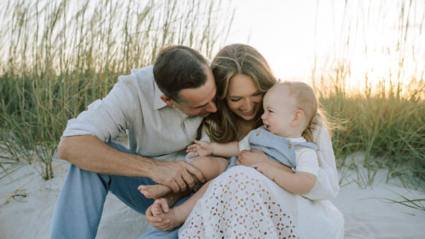 Couple and baby on Amelia Island by Page Teahan Photography