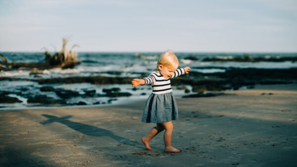 Child on Amelia Island beach, shot by Page Teahan Photography