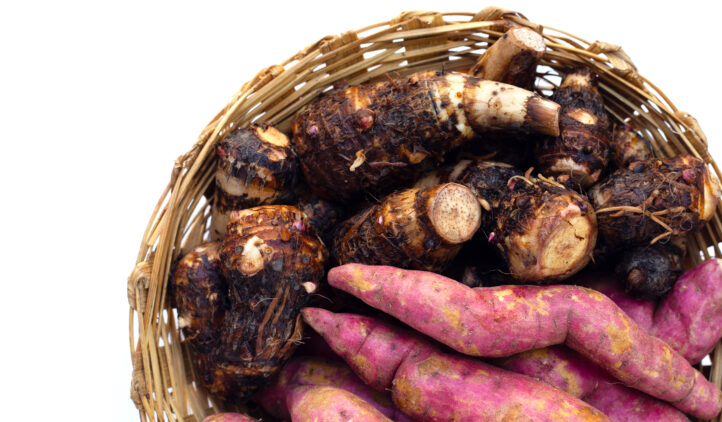 Sweet potato with taro in bamboo basket on white background