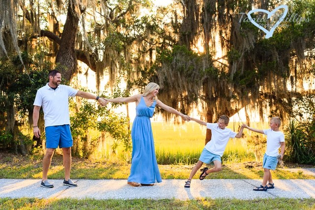 family posing together in blue