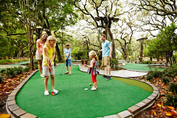 Family playing putt putt