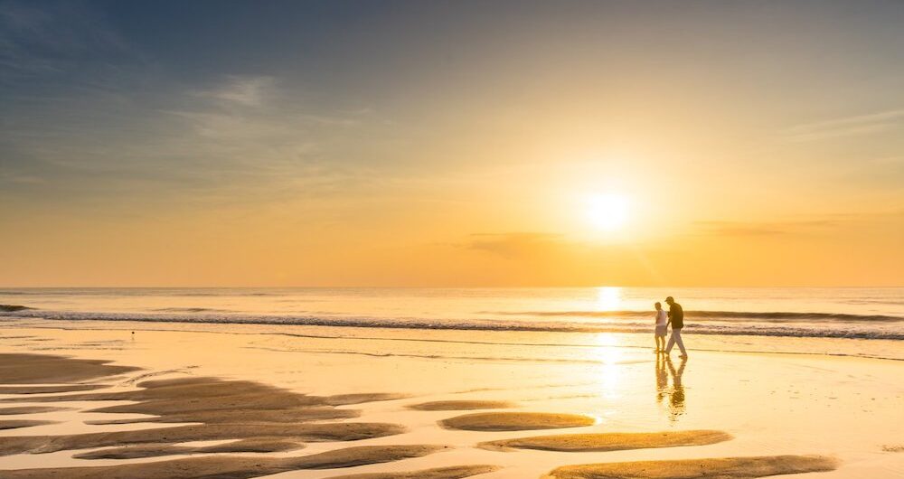 couple on beach at sunset