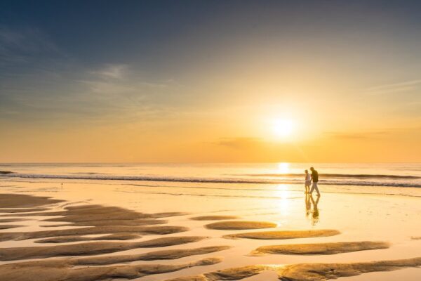 couple on beach at sunset