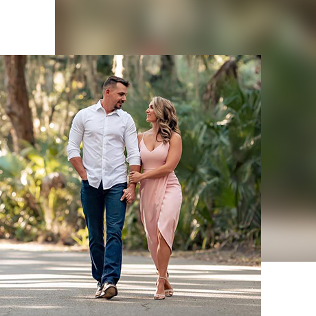 man and woman walking forest