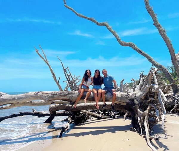 family posing on log